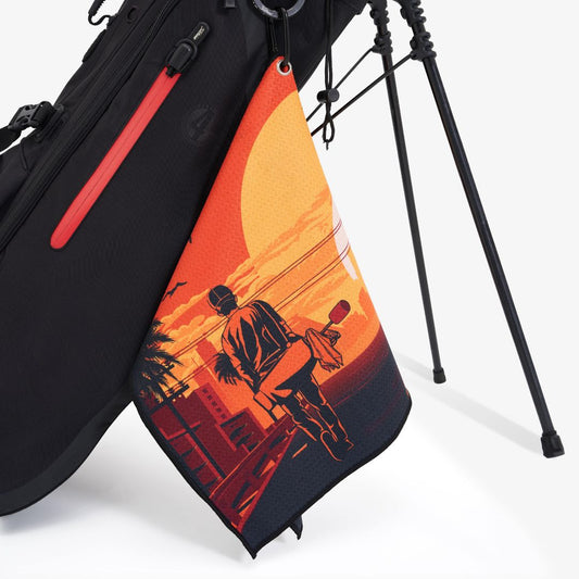 orange golf towel with sunset